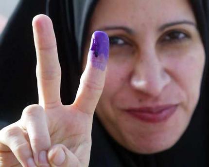 Iraqi woman showing purple finger